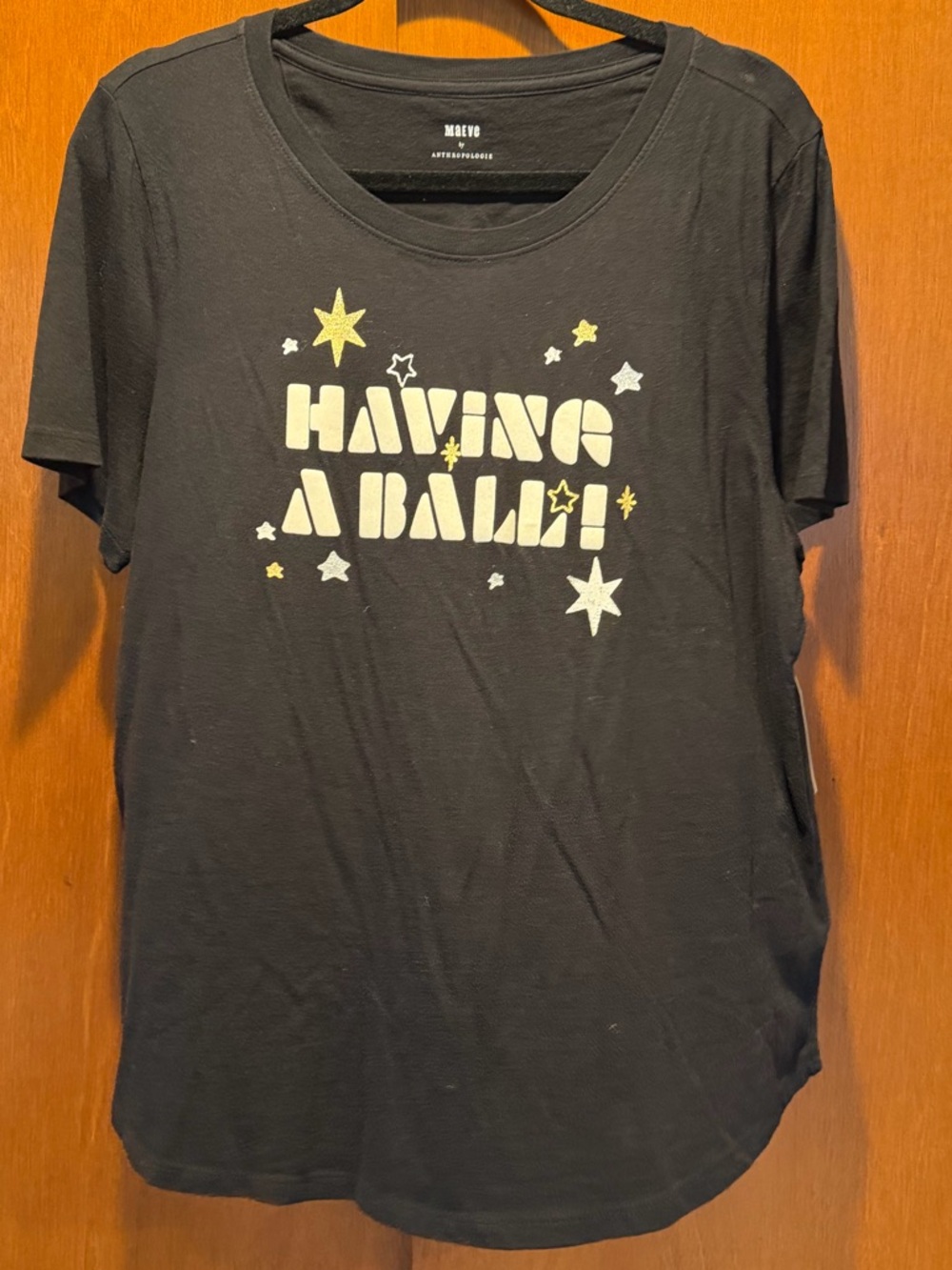 Anthropologie Black Tee with Yellow and White Star Graphic